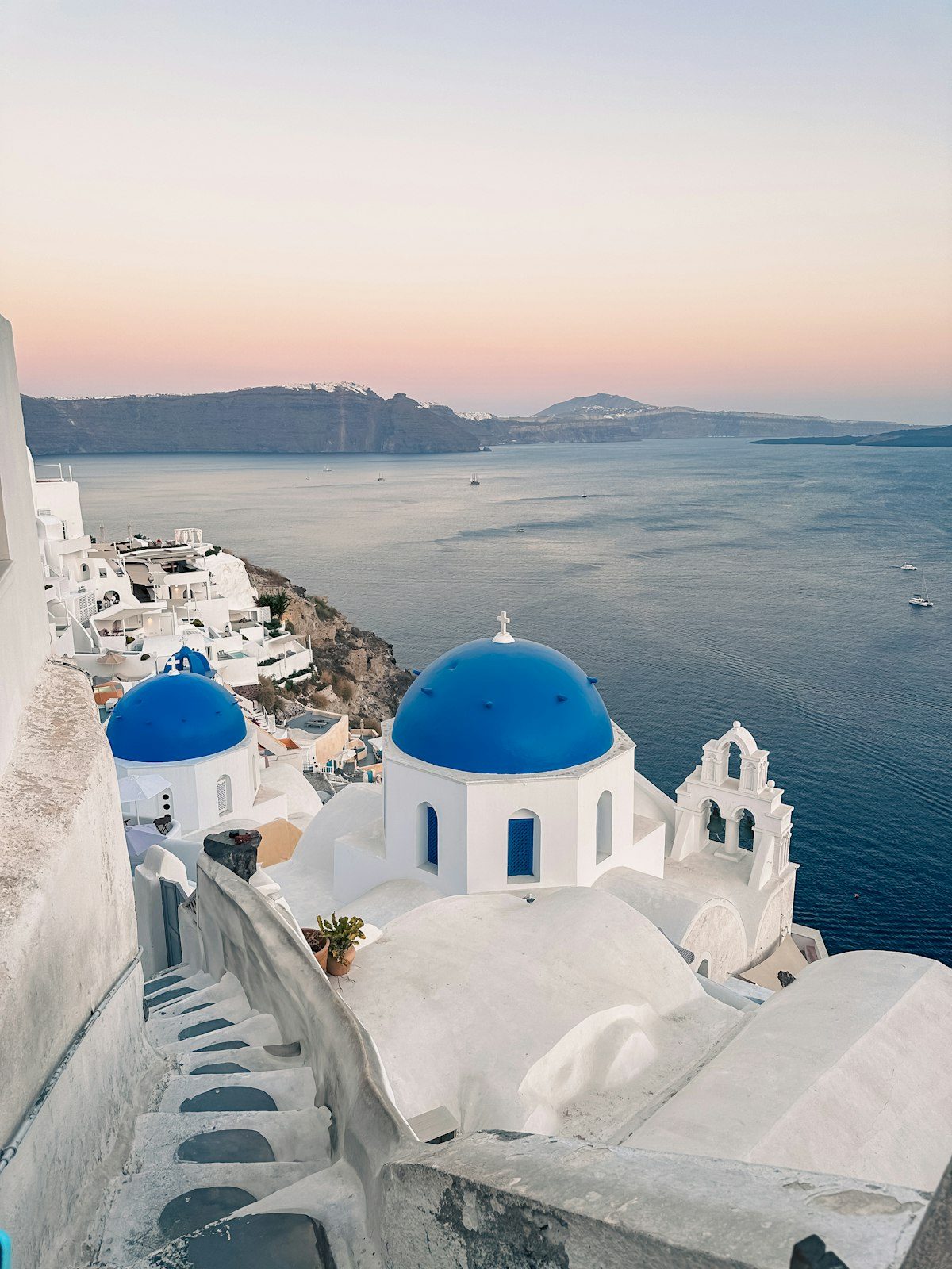 Blue domed church above the sea in Santorini